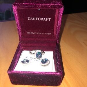 925 Sterling Sliver ring, and matching earrings stone is Amethyst and Sapphire.